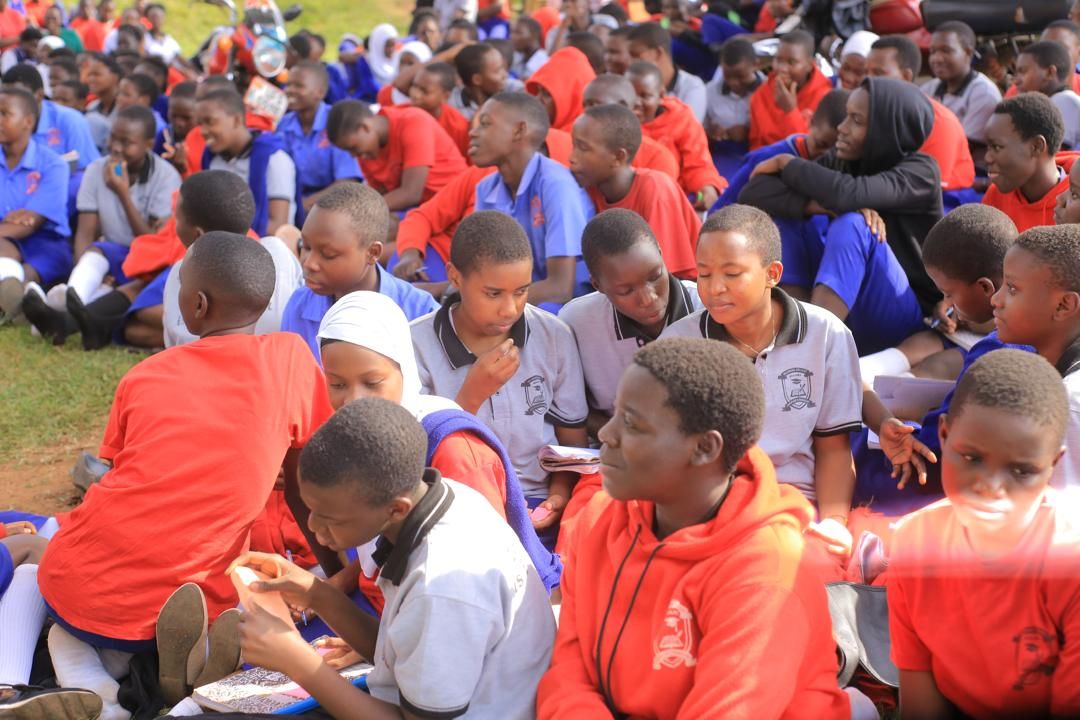 Secondary school students listening during an outreach